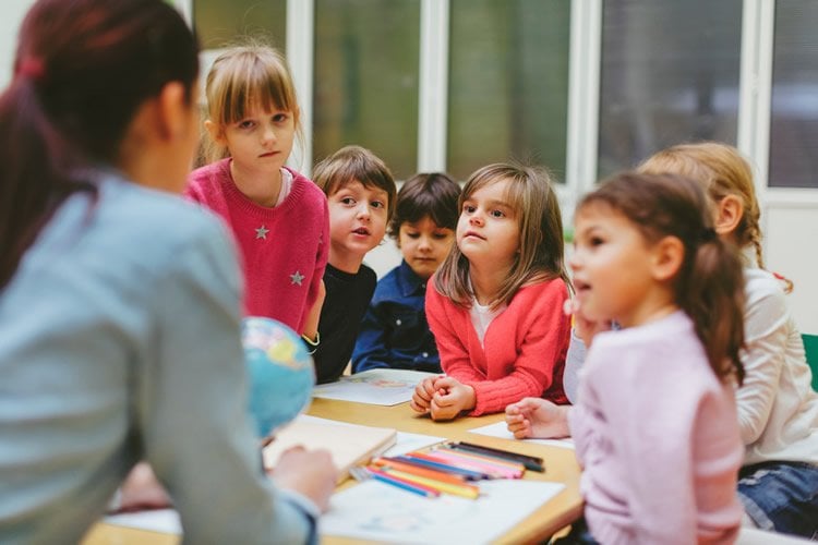 Image shows kids in a classroom.