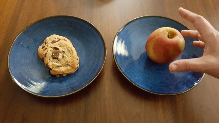 Image shows a cookie and an apple.