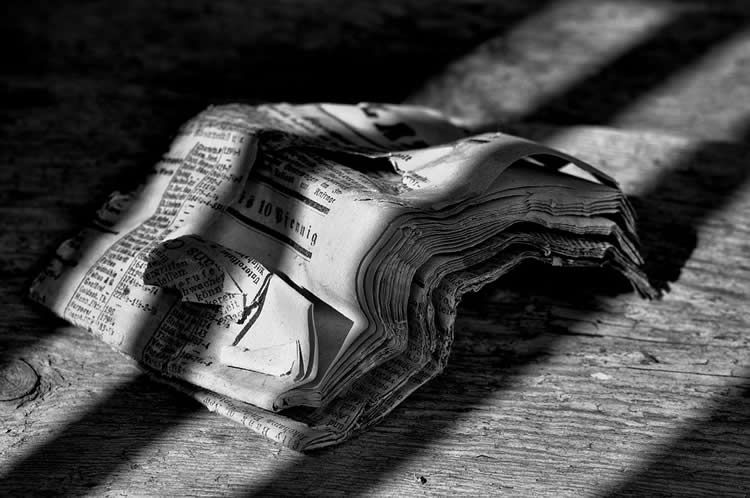 Image shows a scrunched up newspaper.