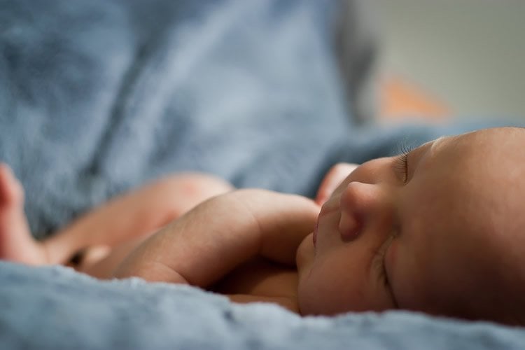 Image shows a sleeping baby.