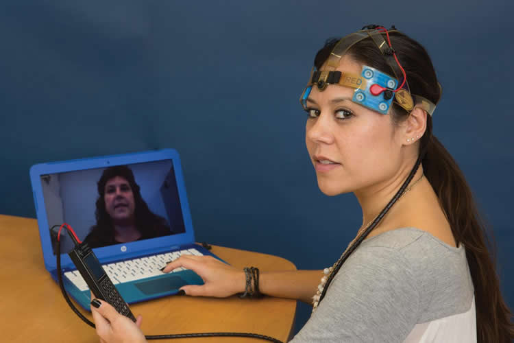 Image shows the researcher with the tdcs equipment.