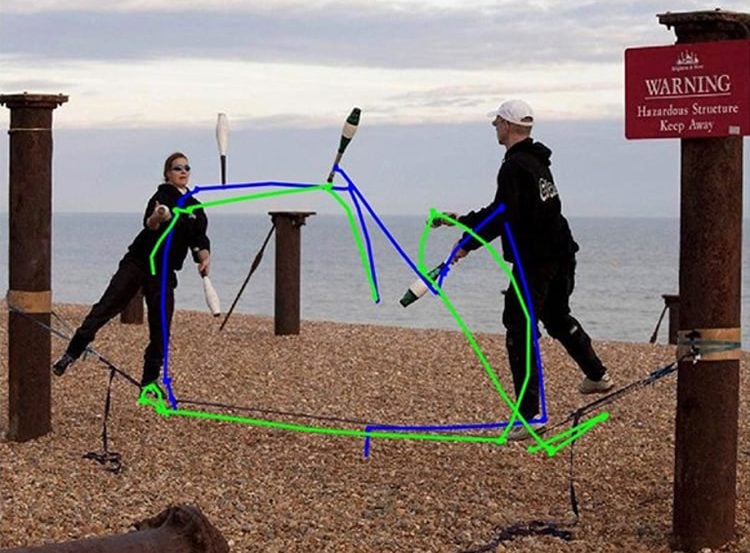Image shows people juggling on a beach.