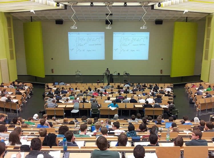 Image shows a lecture hall.