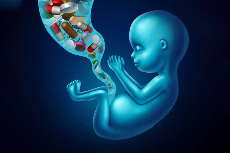 Image shows a baby and pills.