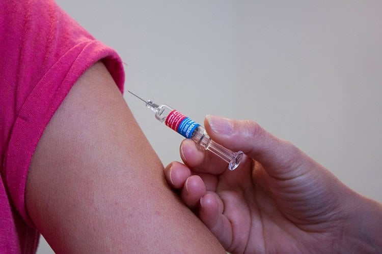 Image shows a syringe.