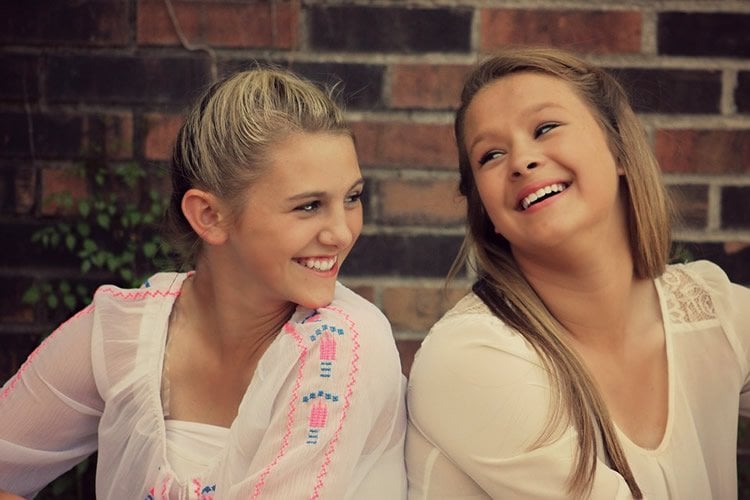 teenaged girls laughing