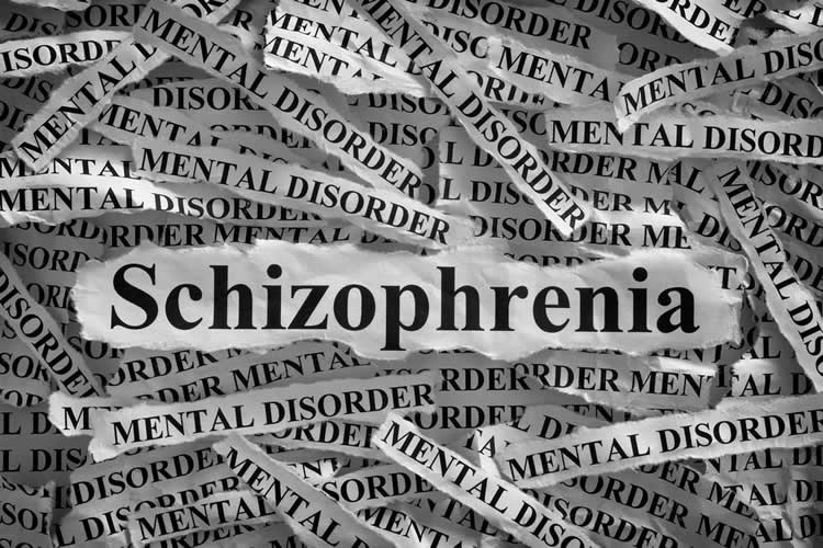 The word Schizophrenia is shown in newspaper print