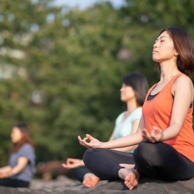 This shows women meditating