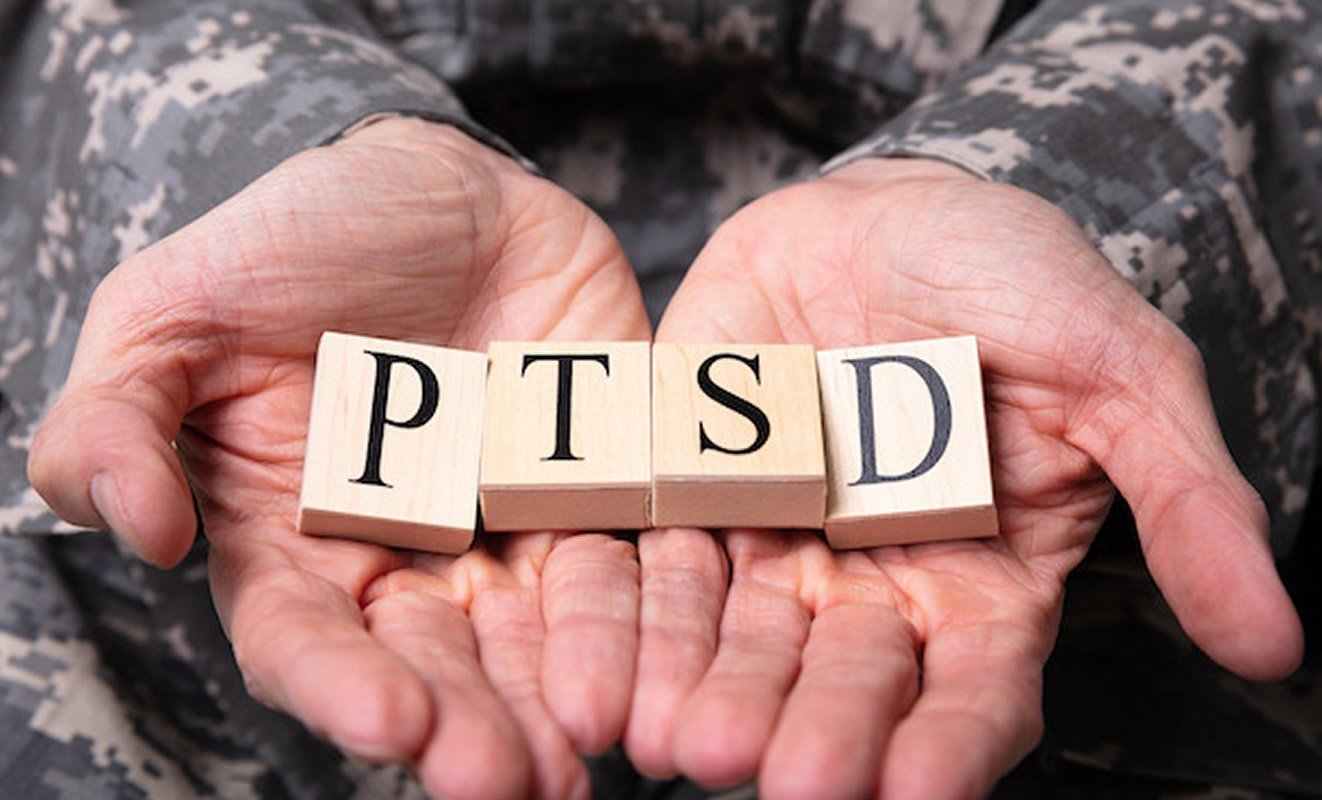 This shows someone with PTSD made from scrabble letters in their hands