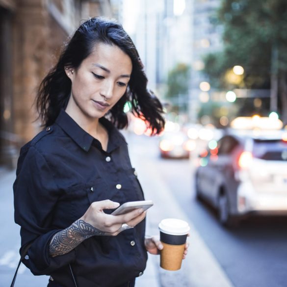 This shows a woman on her phone