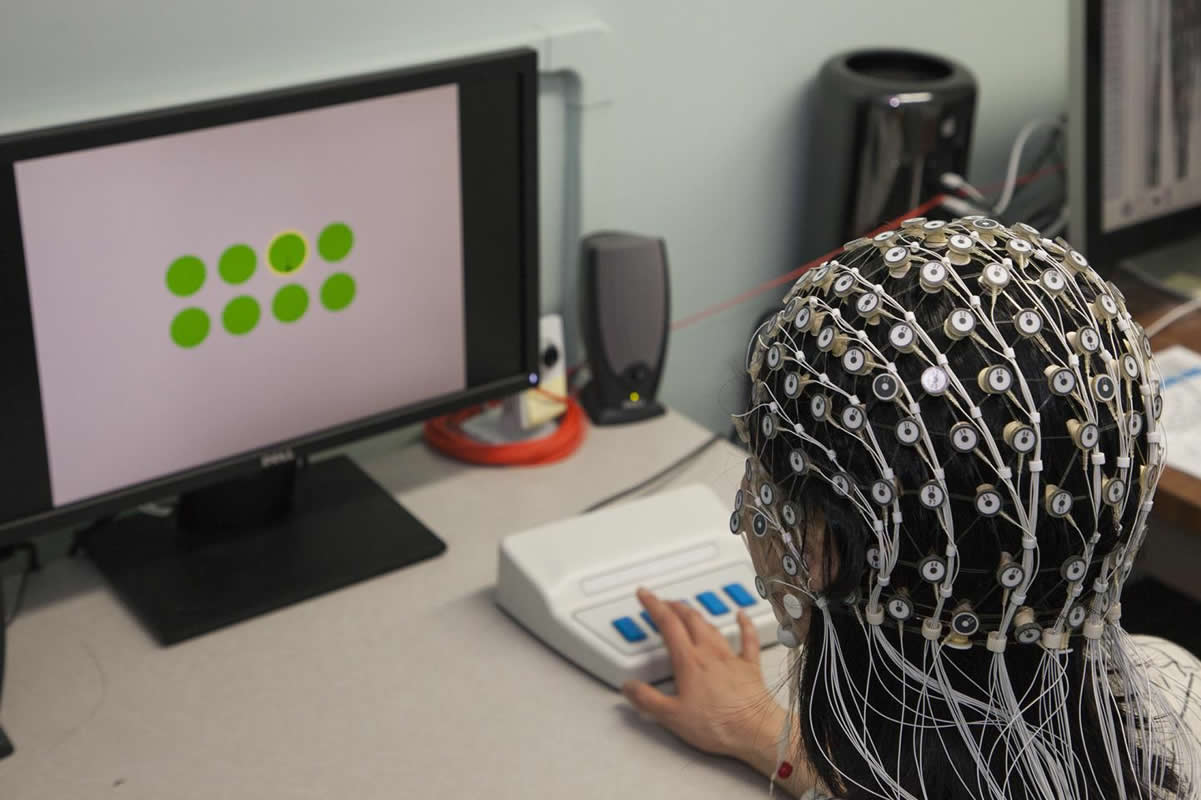 This shows a person in an EEG cap