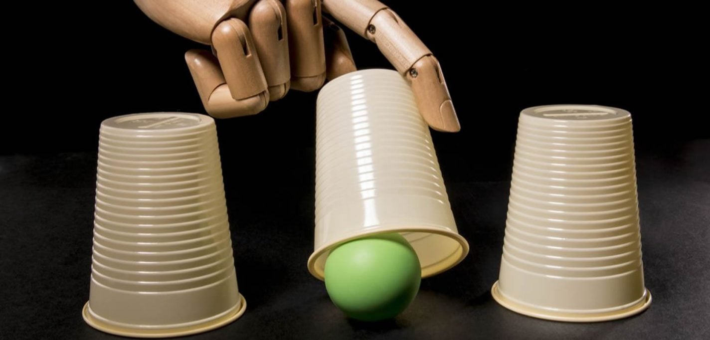 This shows a robotic hand playing the ball under the cup game