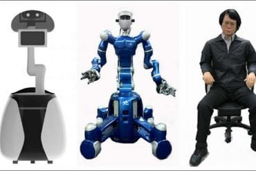 This shows two robots and a man
