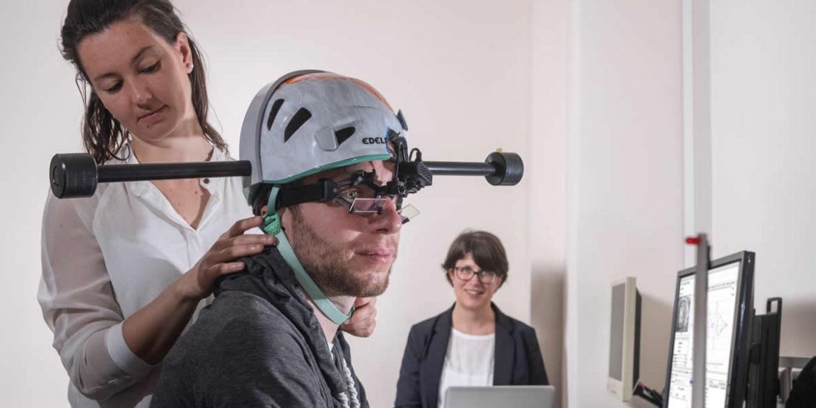This shows a patient wearing the weighted headset