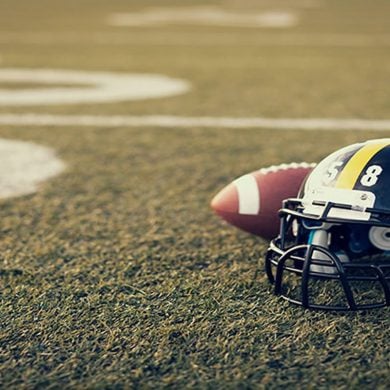 This shows a football and helmet on a field