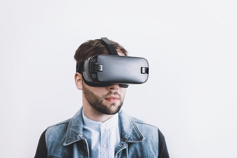 This shows a man in VR glasses