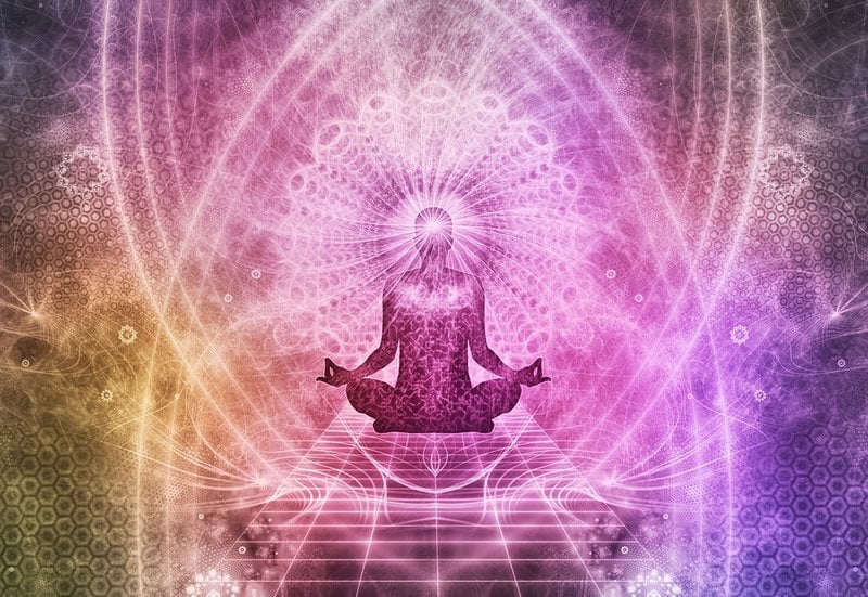 This shows a person in the lotus position with a psychedelic background