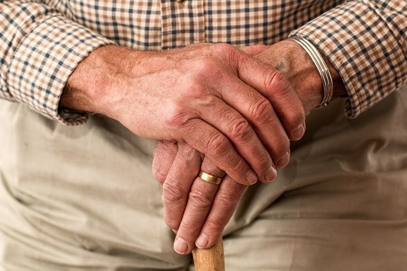 This shows an old man's hands