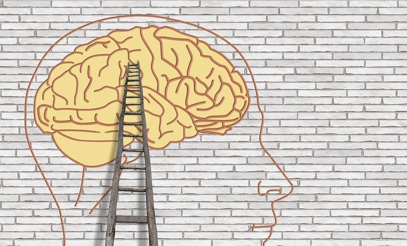 This is a drawing of a brain on a wall and a ladder