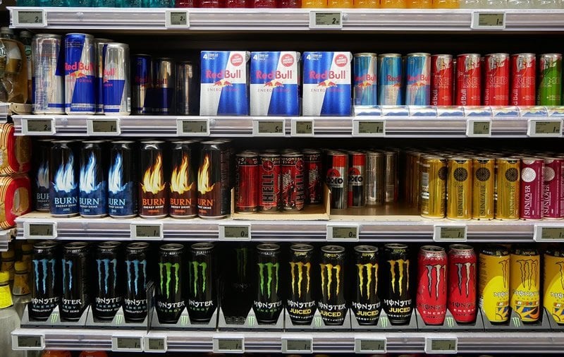 This shows energy drinks on a shop's shelves
