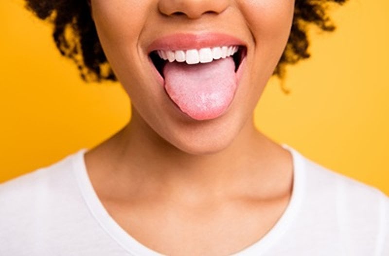 This shows a woman sticking out her tongue