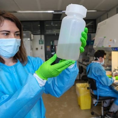 This shows a researcher examining water