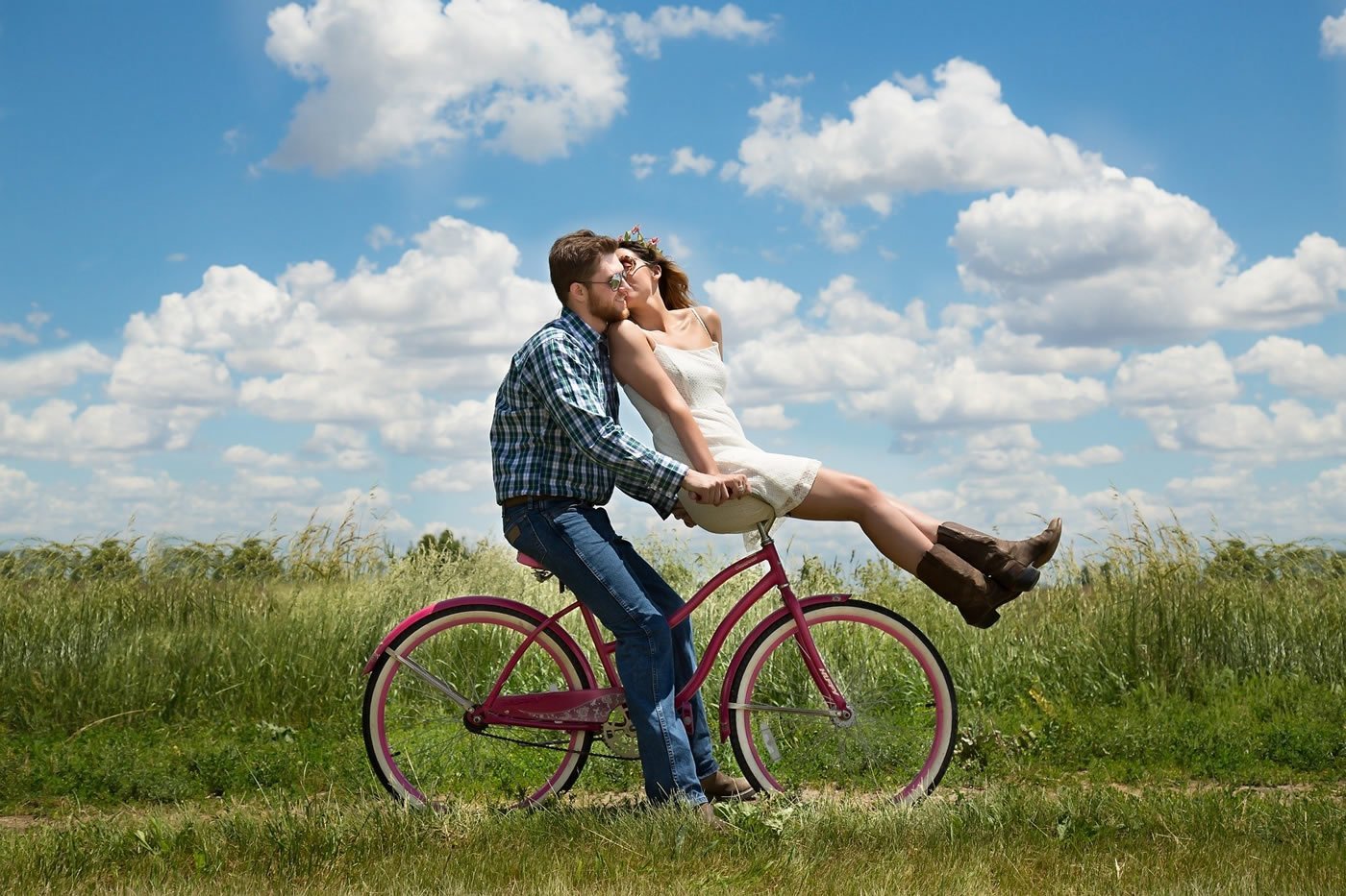 This shows a couple on a bicycle