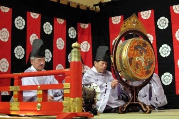 This shows musicians playing traditional japanese instruments