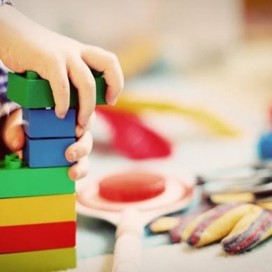 This shows a child playing with blocks