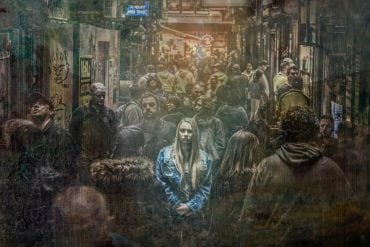 This shows a woman standing out in a crowd