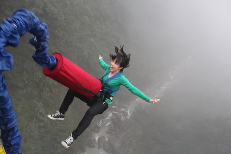 This shows a woman bungee jumping