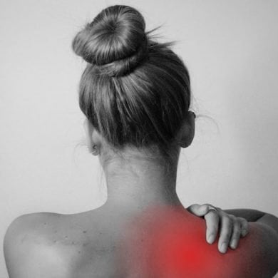 This shows a woman rubbing an inflammed shoulder
