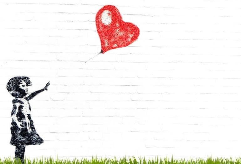 This shows a drawing of a child and a heart shaped balloon blowing away