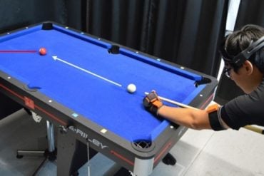 This shows a person playing pool