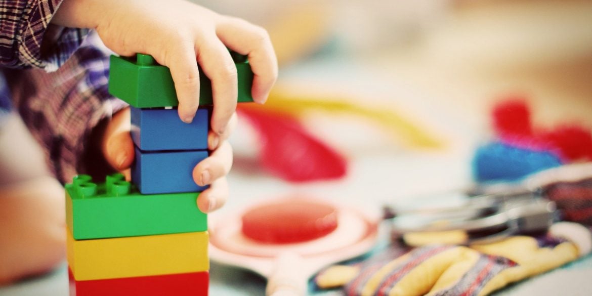 This shows a child playing with building blocks