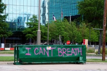 This shows a wall painted with "I Can't Breath"