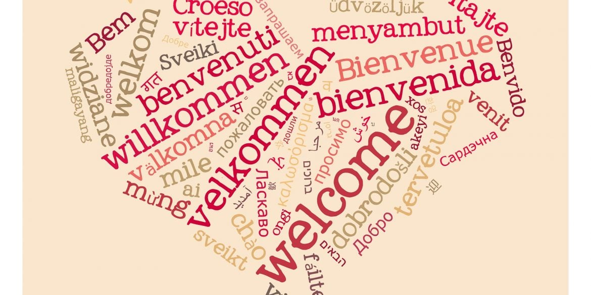 This shows the word "welcome" written in different languages in the shape of a heart
