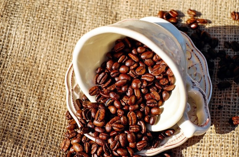 This shows coffee beans in a coffee cup