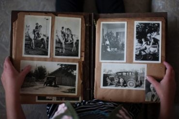 This shows a person looking at old photos