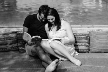 This shows a couple reading to eachother