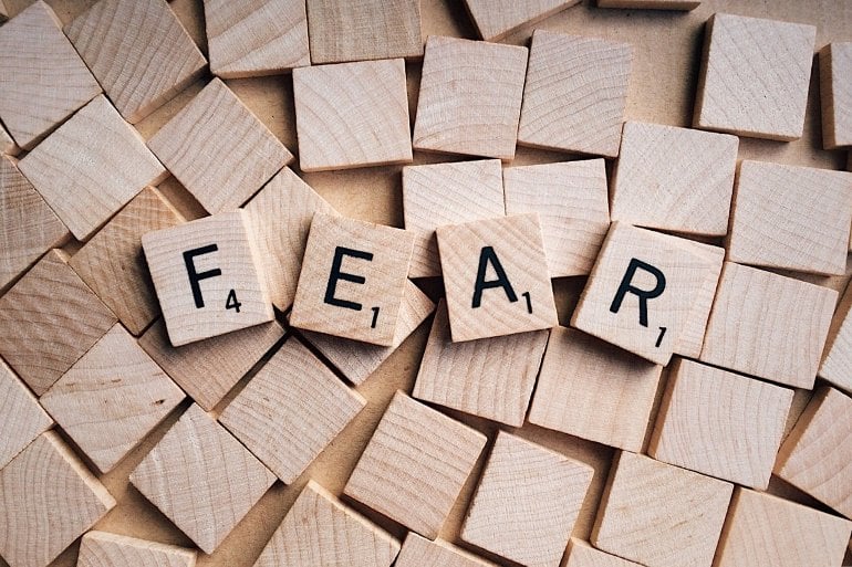 This shows the word fear written in scrabble tiles