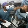 This shows an anesthesiologist taking care of a patient while under anesthetic