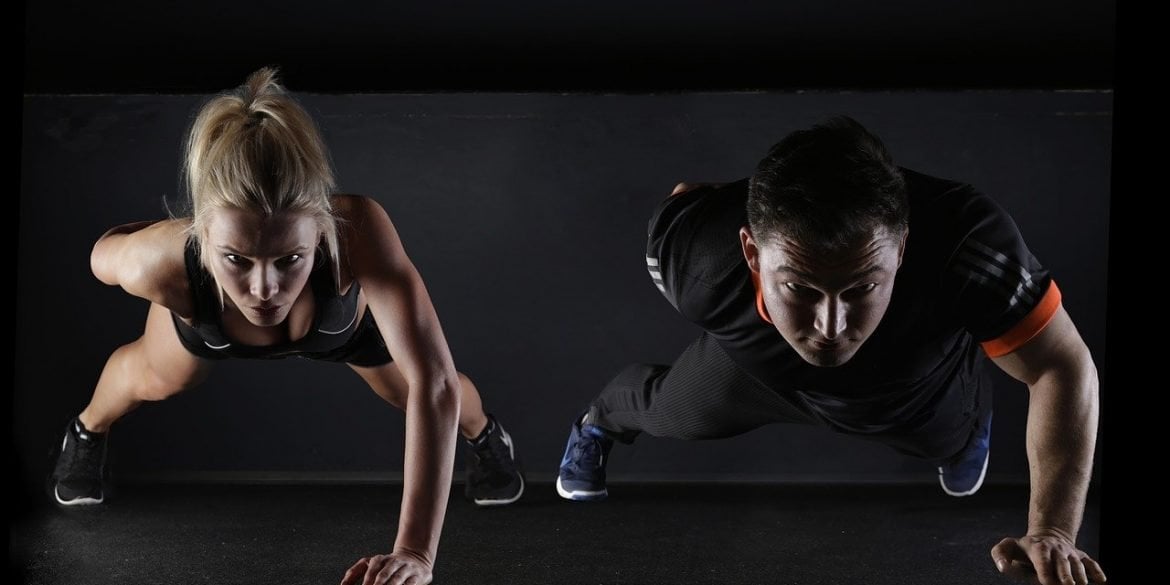 This shows a man and woman doing push-ups