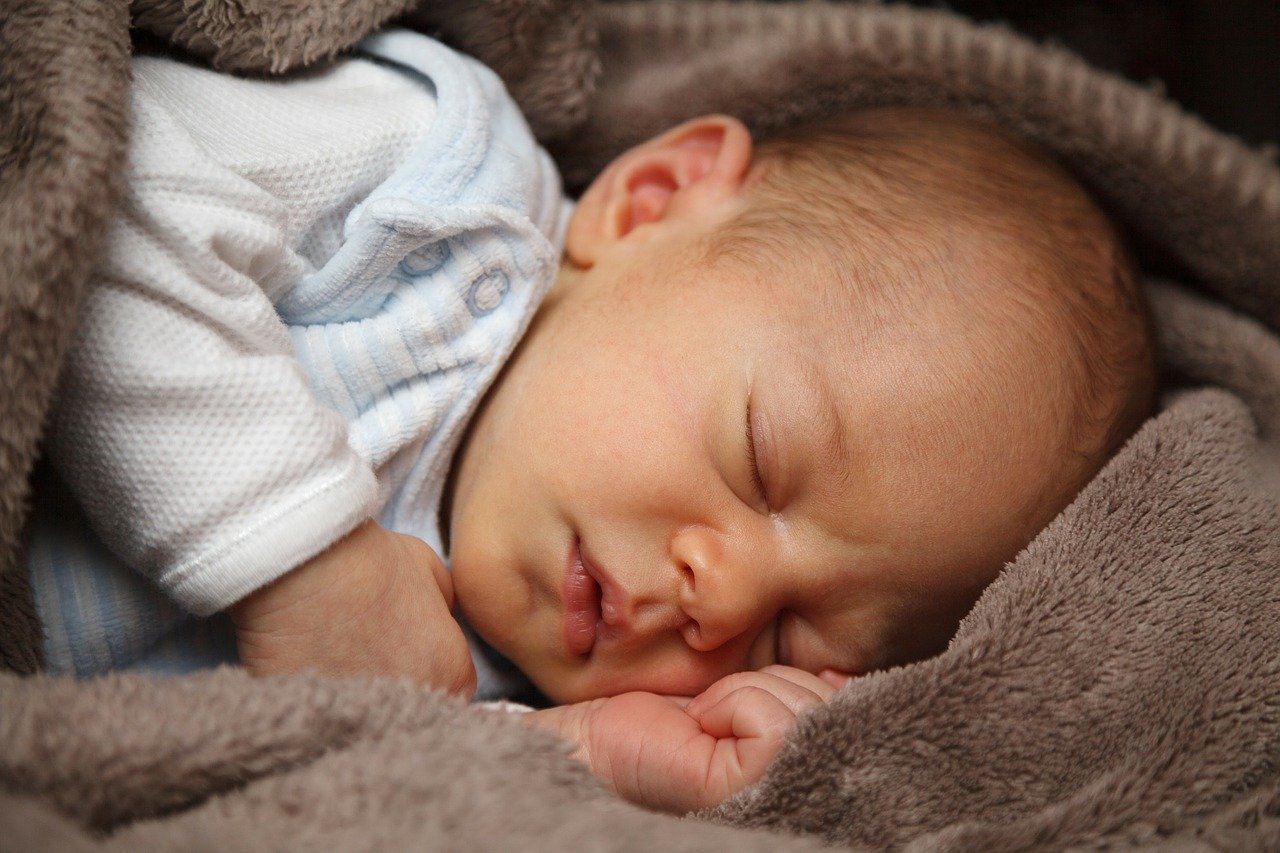 This shows a sleeping newborn