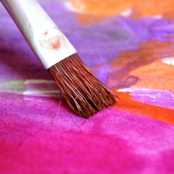 This shows a paint brush adding a bright pink to a painting