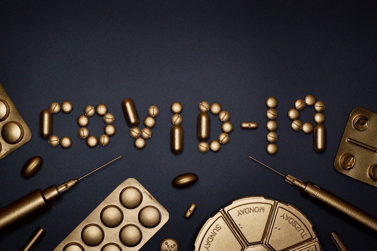 This shows pills spelling out covid-19