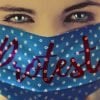 This shows a woman with a faskmask with the word protest written on it