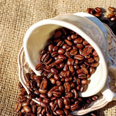 This shows a cup full of coffee beans