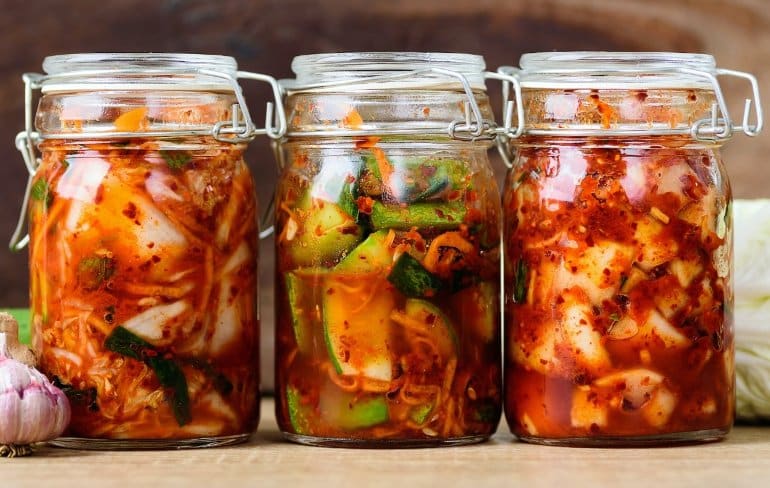 This shows three jars of kimchi
