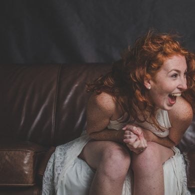 This shows a woman laughing